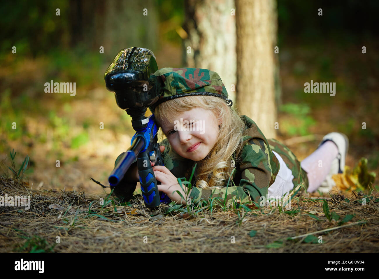 girl in camouflage suit with rifle Stock Photo Alamy