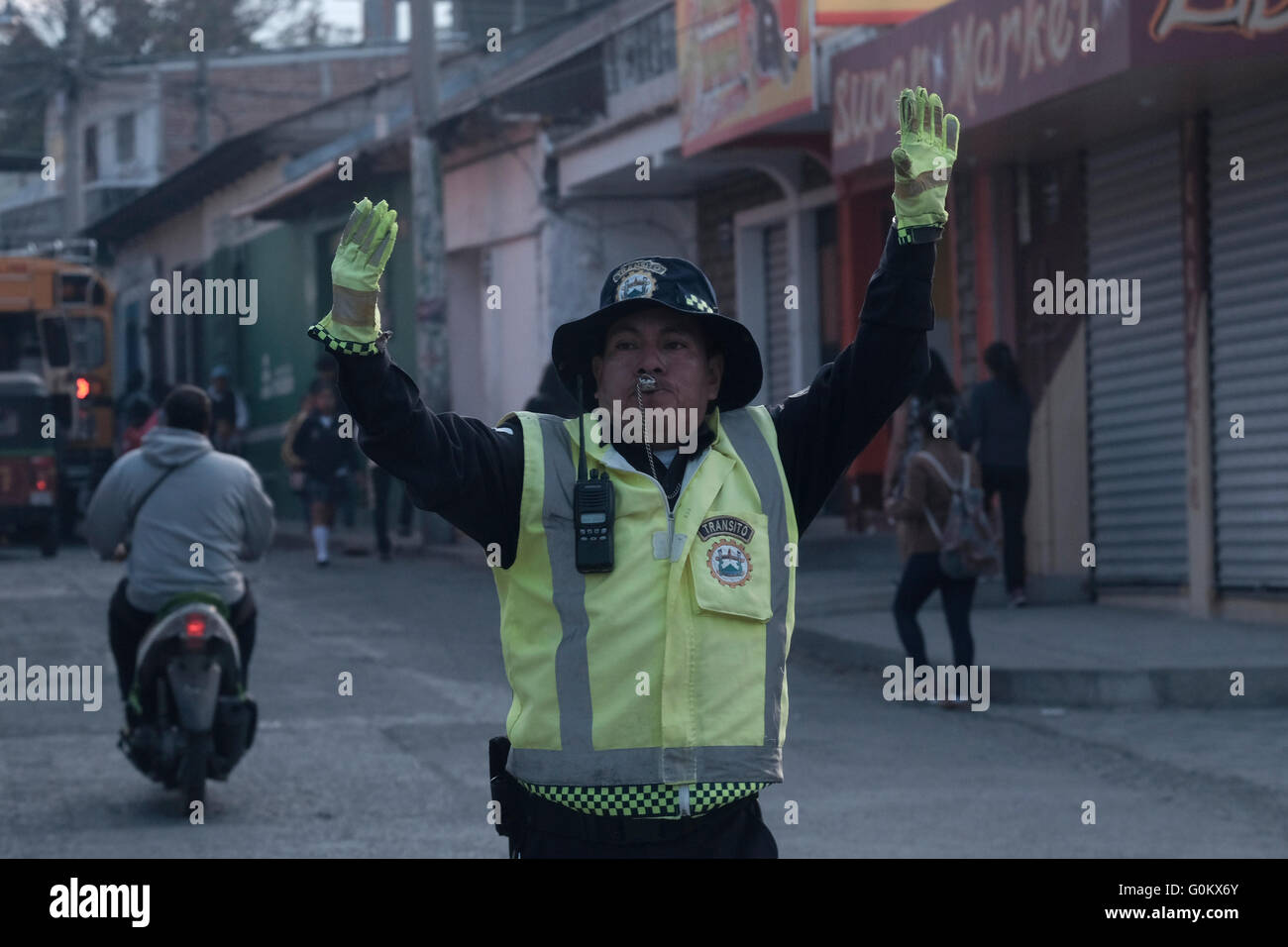 Police directing traffic in Chichicastenango a town in the El Quiche department of Guatemala, known for its traditional Kiche Maya culture. Stock Photo