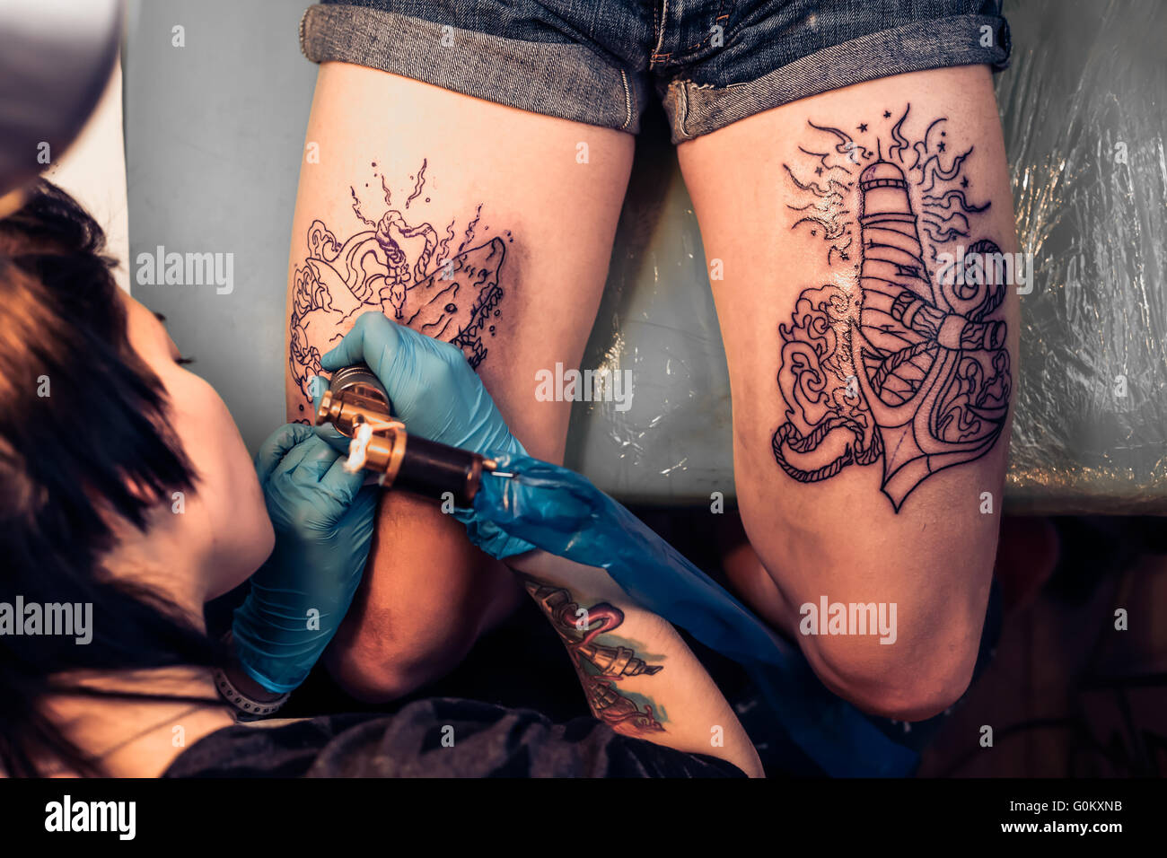 Top view of making tattoo in salon Stock Photo - Alamy