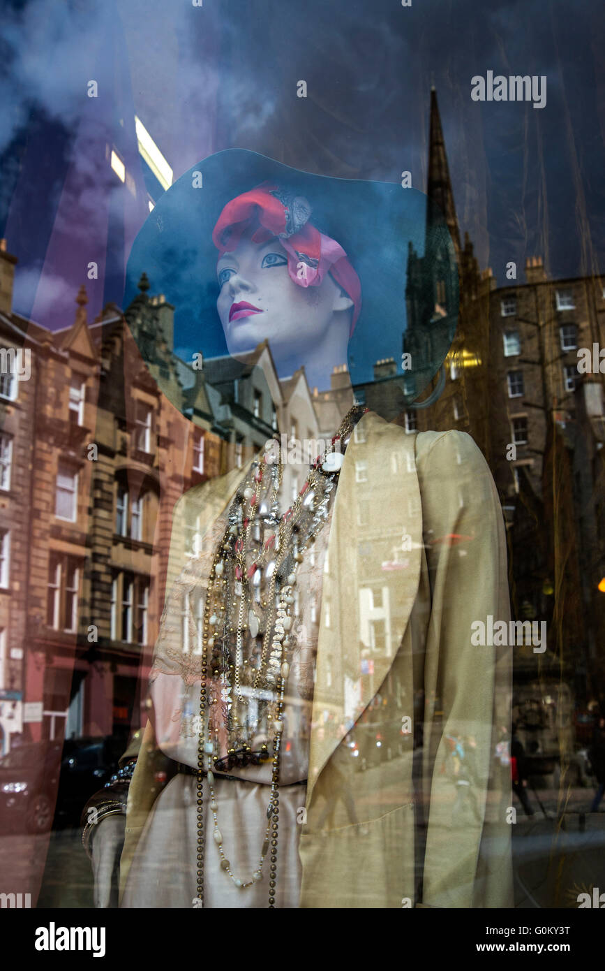 A mannequin in the window of Armstrongs vintage clothing store with Victoria Street reflected on the glass. Stock Photo