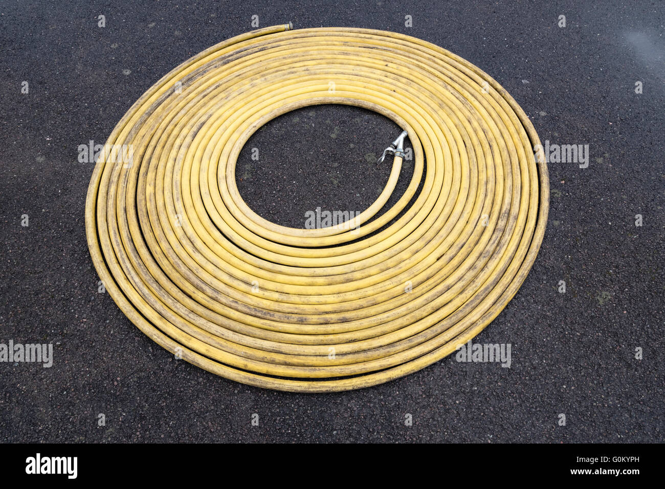 Coil yellow water hose Stock Photo Alamy