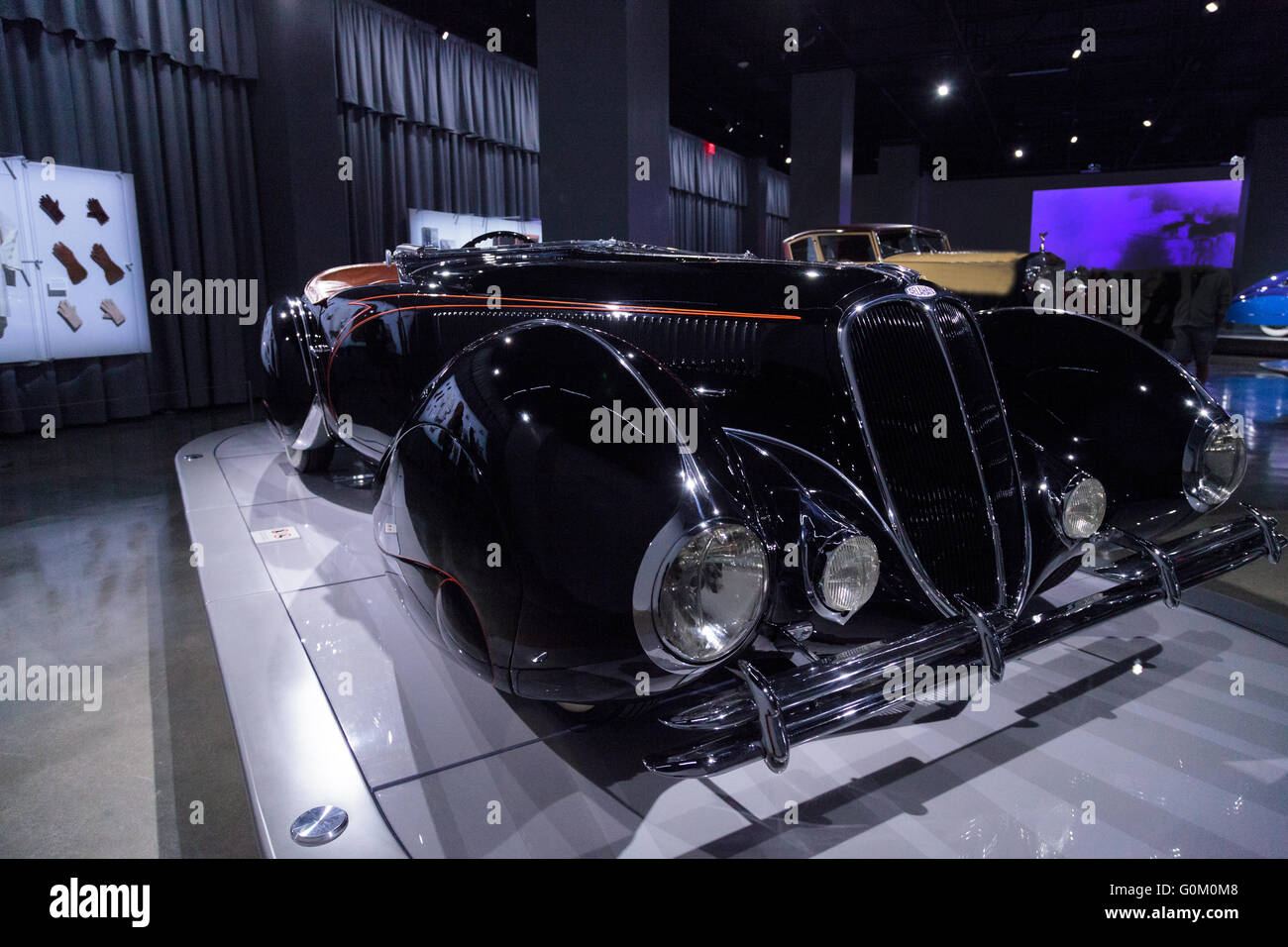 This black and orange 1938 Delahaye Type 135M Competition Roadster by Figoni et Falaschi on display at the Petersen Automotive M Stock Photo