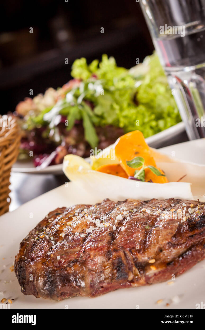 Grilled beef steak with seasoning Stock Photo - Alamy
