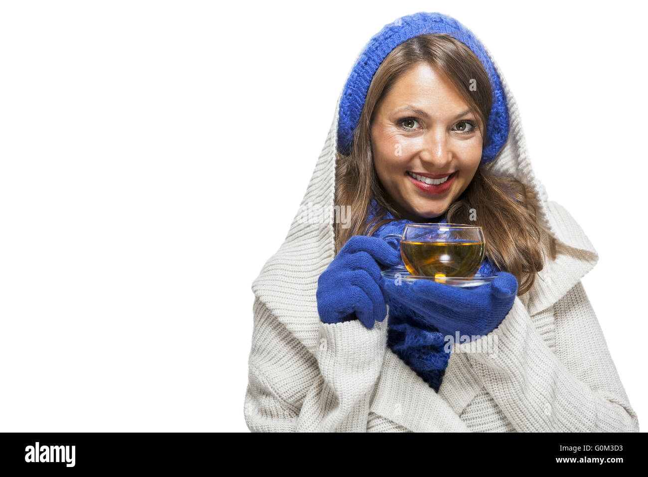 Fashionable young woman sipping hot tea Stock Photo