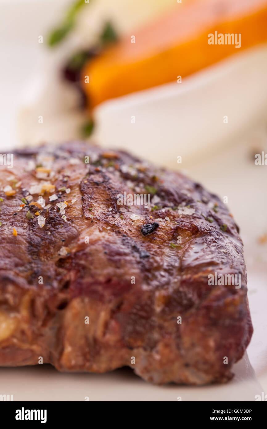 Grilled beef steak with seasoning Stock Photo