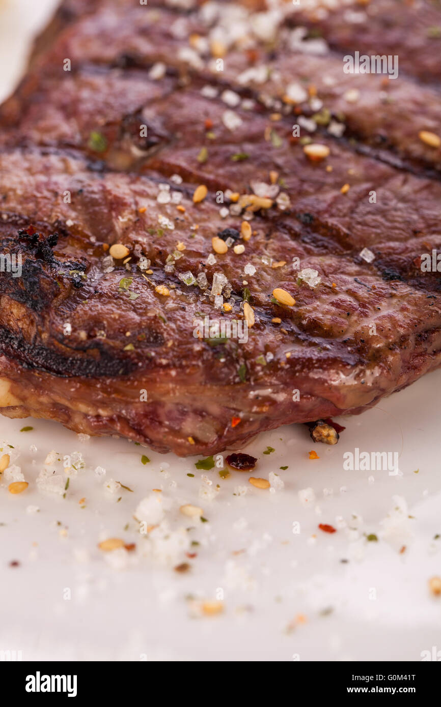 Grilled beef steak with seasoning Stock Photo - Alamy