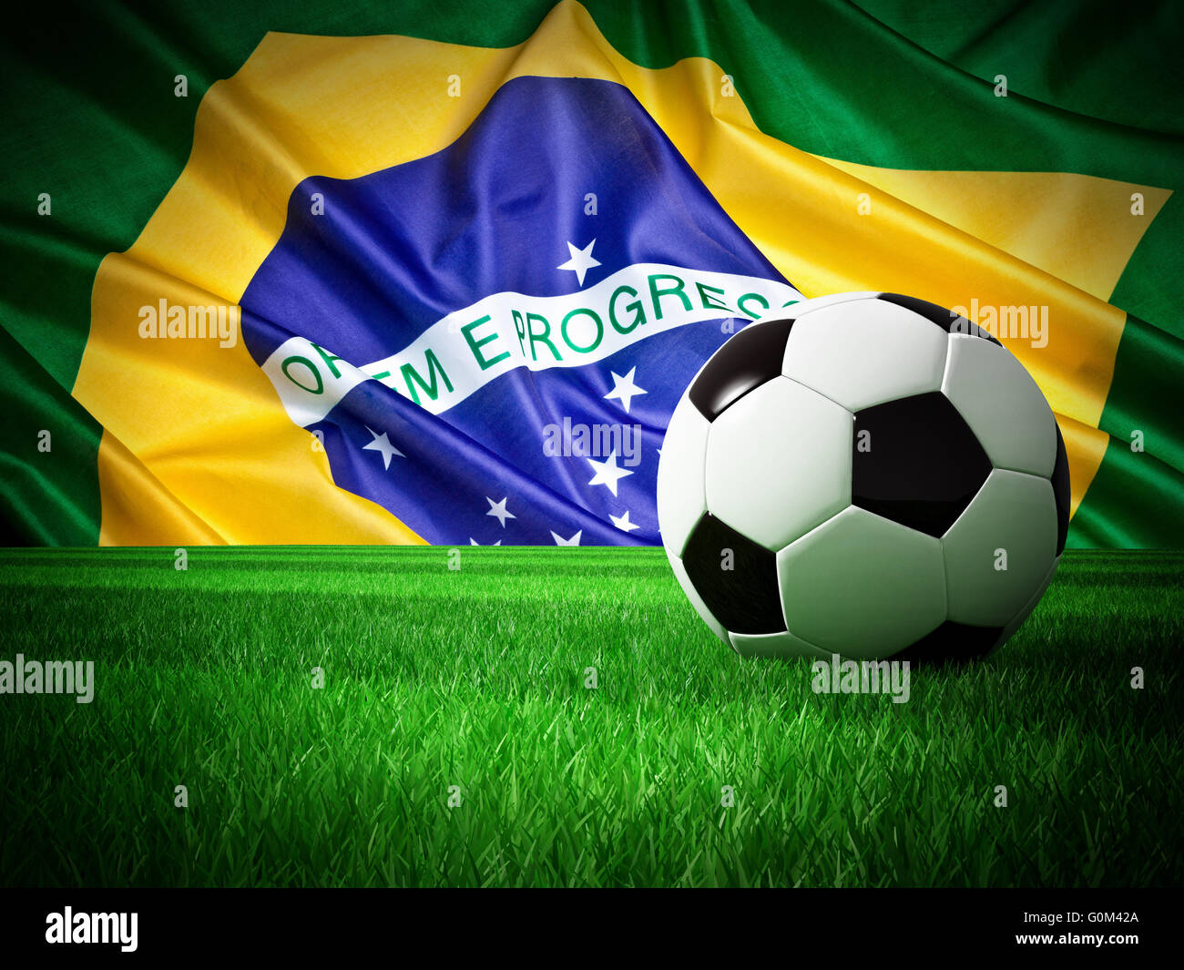 soccer ball on grass and brazil flag Stock Photo