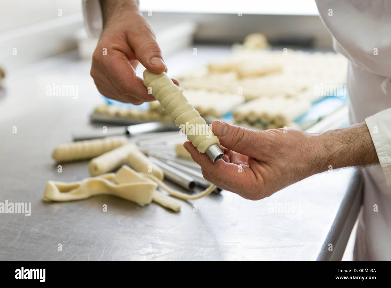 pastry chef shapes the dough with your hands for cookies Stock Photo