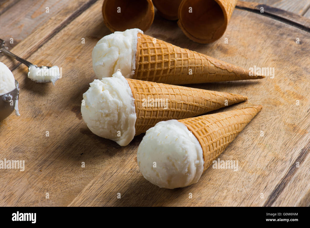 creamy vanilla ice cream in preparation with rustic background and ...