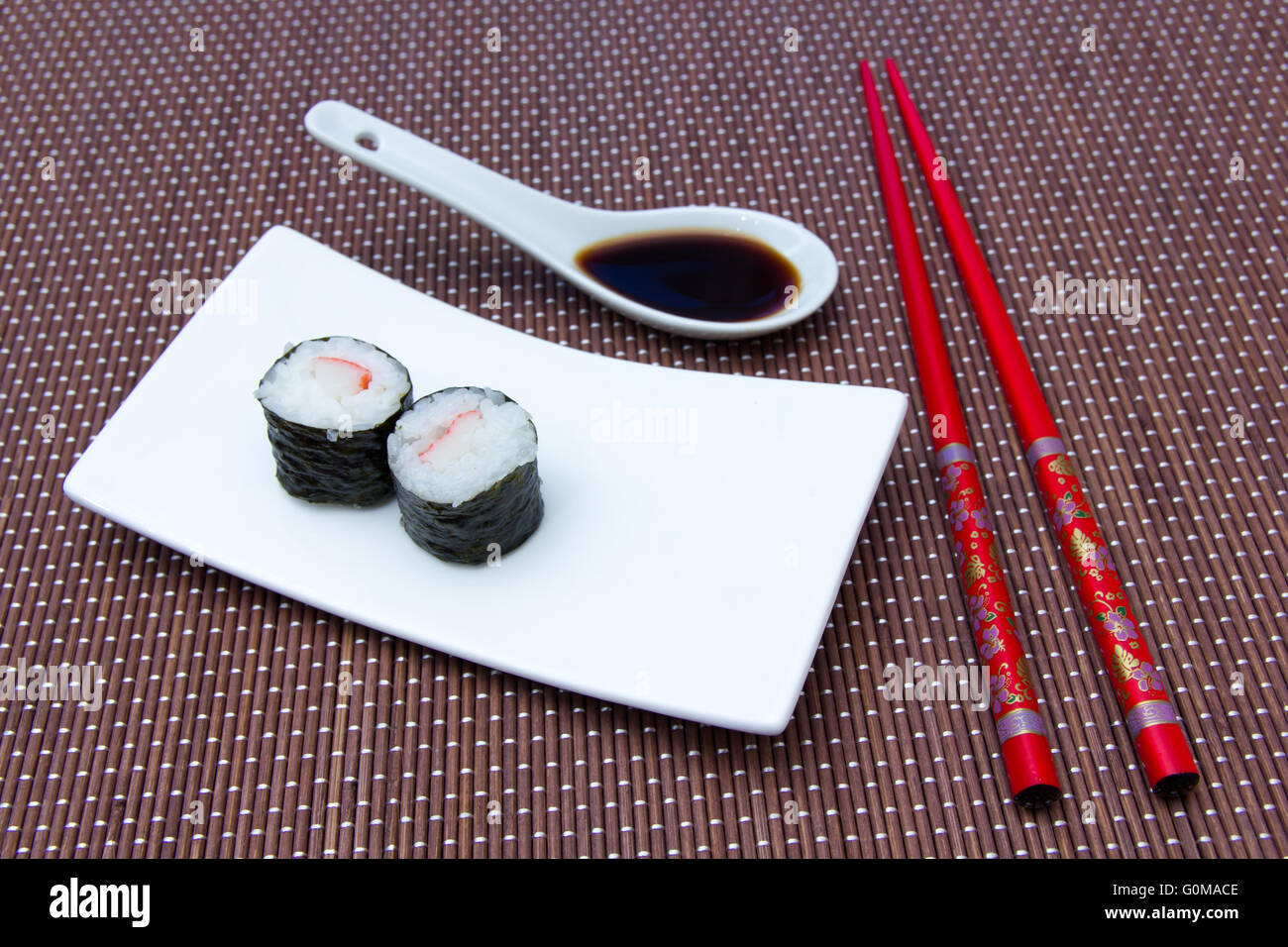 Maki with surimi on a bamboo mat Stock Photo