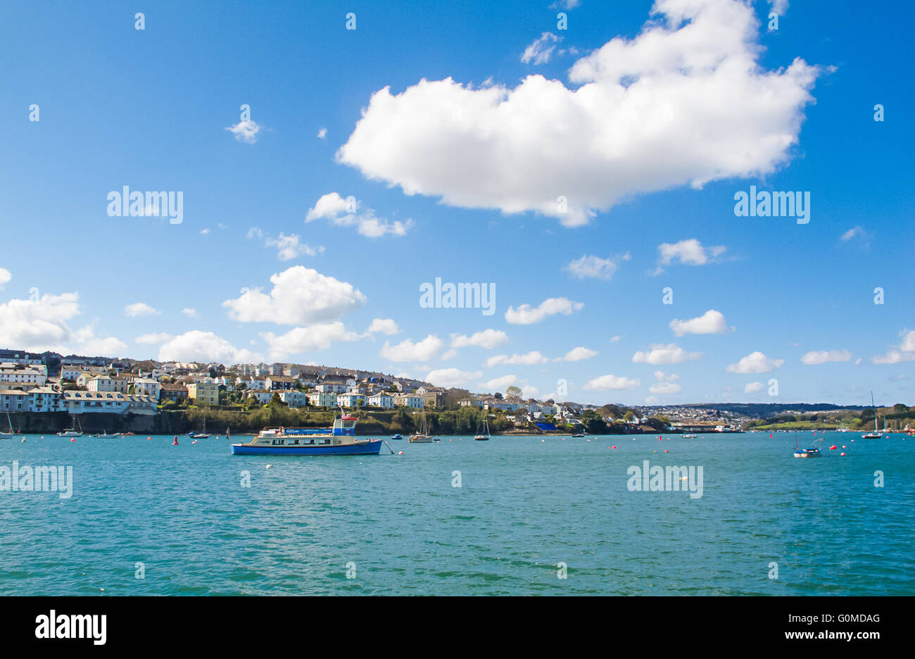 View of the Penryn River between Falmouth and Flushing in the UK, showing the Flushing ferry in the distance. Stock Photo