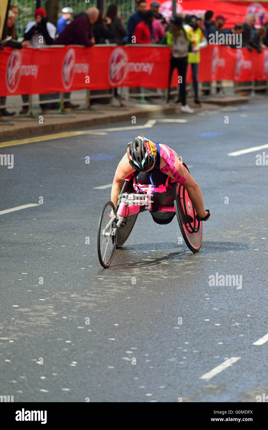 Woman Wheelchair competitor, 2016 Virgin Money London Marathon, Canary Wharf, London, United Kingdom Stock Photo