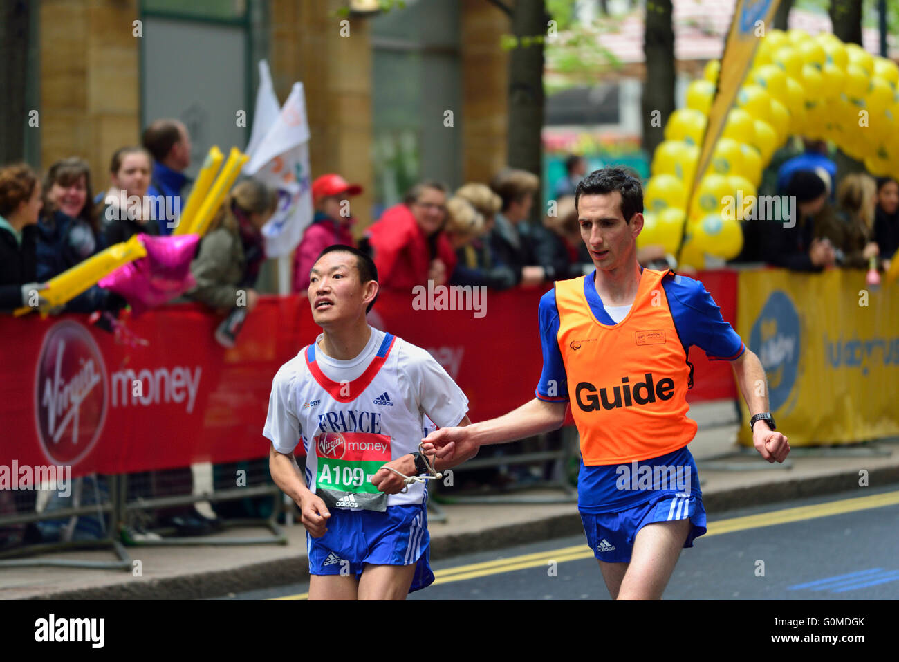 Visually impared competitor with Guide, 2016 Virgin Money London Marathon, London,  United Kingdom Stock Photo