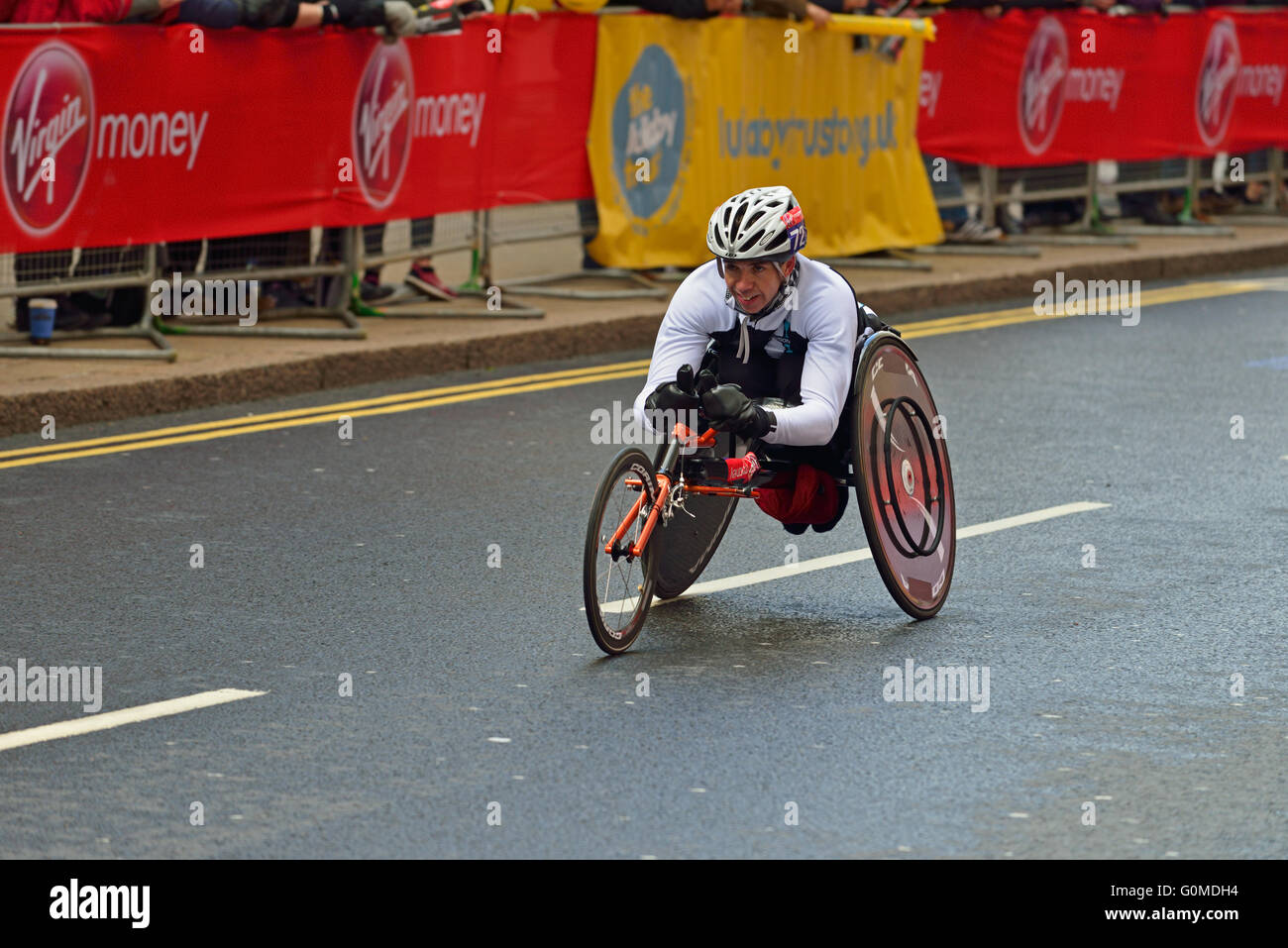 Wheelchair competitor, 2016 Virgin Money London Marathon, Canary Wharf, London, United Kingdom Stock Photo