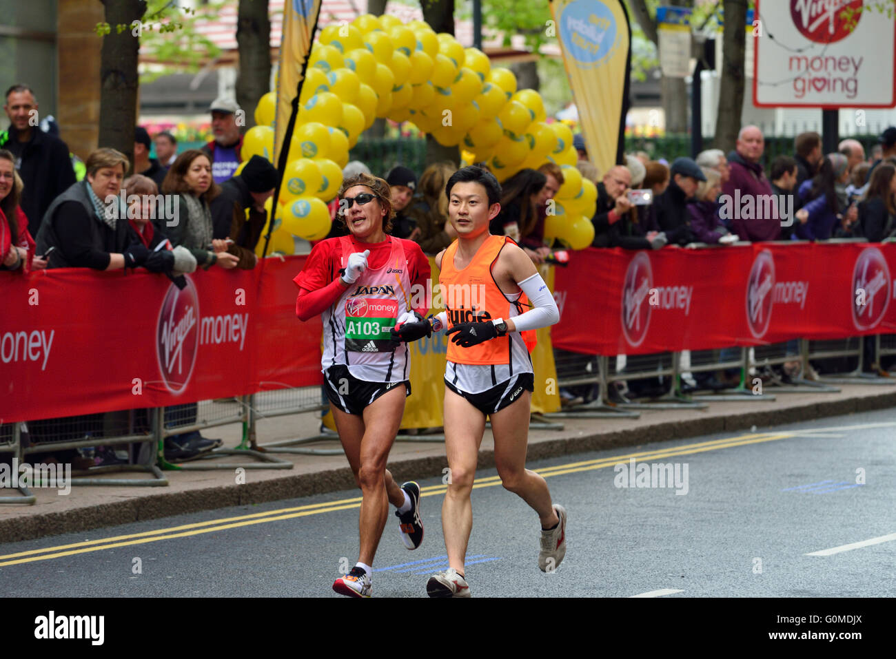 Visually impared competitor with Guide, 2016 Virgin Money London Marathon, London,  United Kingdom Stock Photo