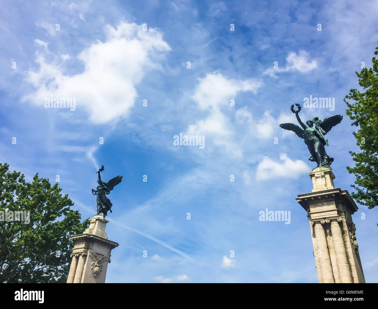 two colossal winged bronze statue on their high socles at the end of Ponte Vittorio Emanuele in Rome Stock Photo