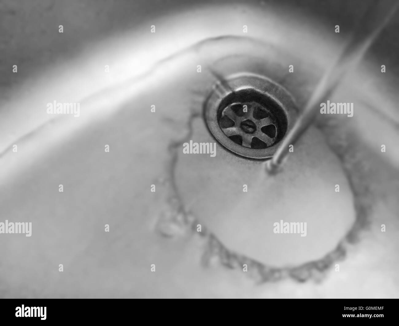 water falling into an alluminium sink Stock Photo Alamy