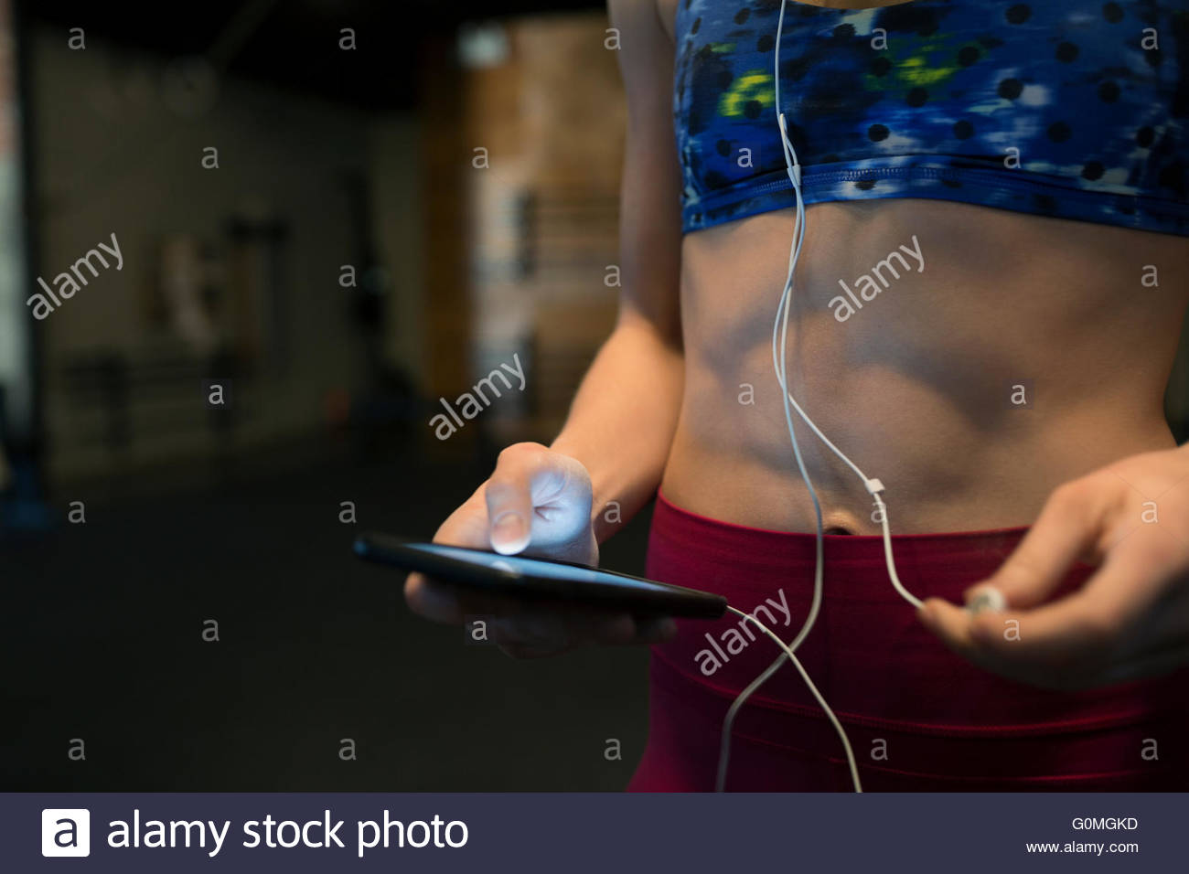 Close up woman headphones and mp3 player gym Stock Photo Alamy