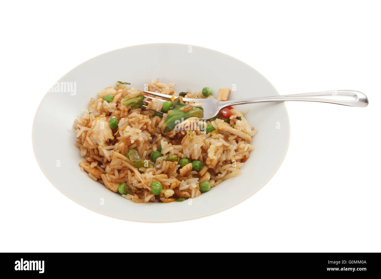 Fried rice in a bowl with a fork isolated against white Stock Photo