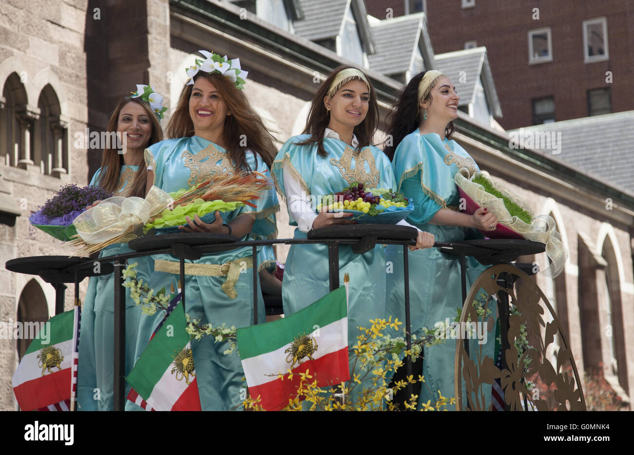 The annual Persian Parade on Madison Avenue in New York City. Costumed women with fruits and grains on a float. Stock Photo