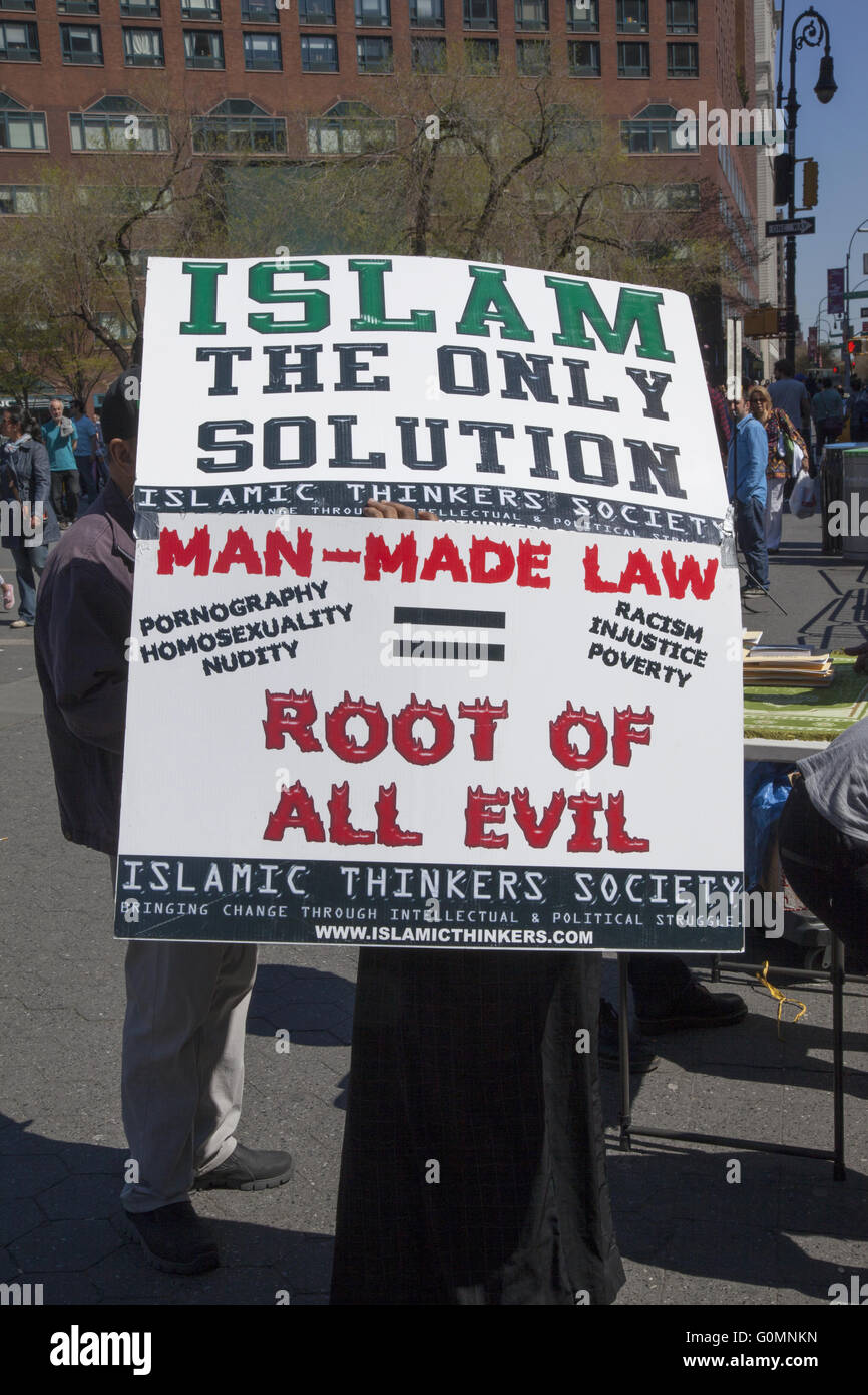 Fundamentalist Muslim  with sign saying Islam is the only solution. Union Square, New York City. Stock Photo