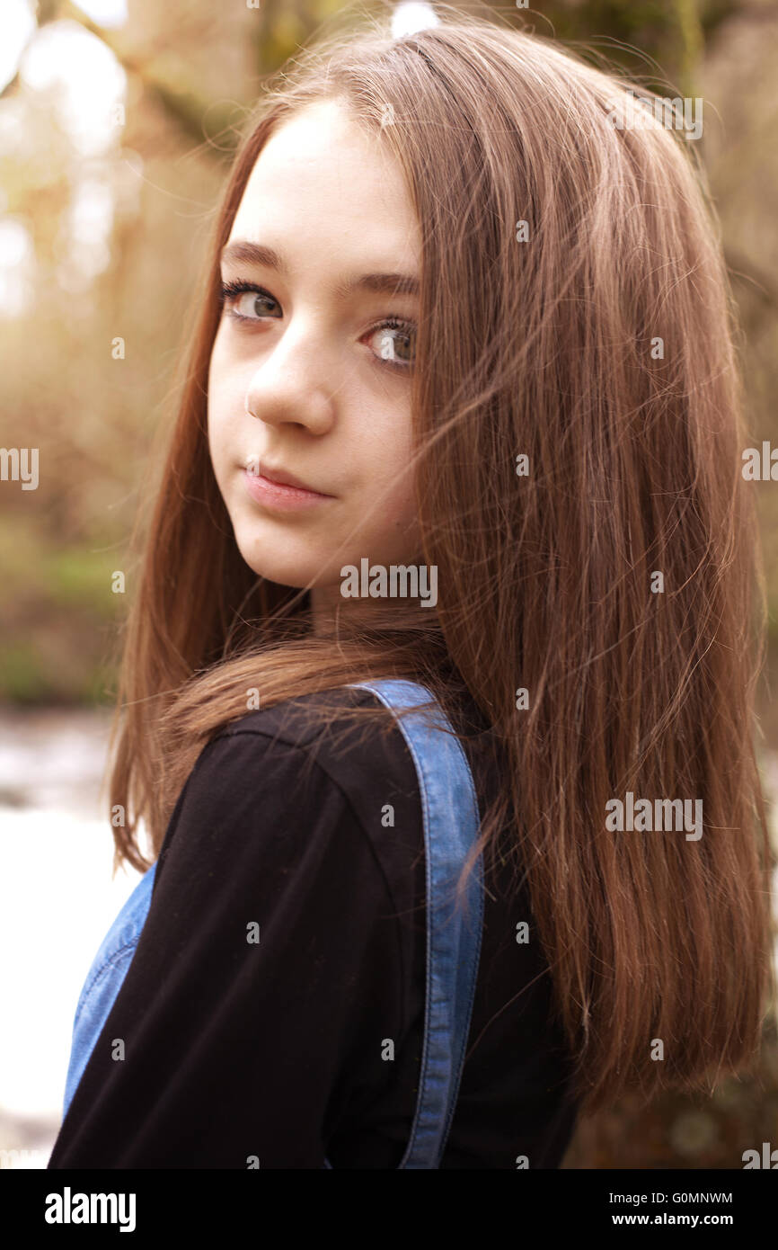 Pretty Teenage Girl Looking Over Shoulder In An Outdoor Setting
