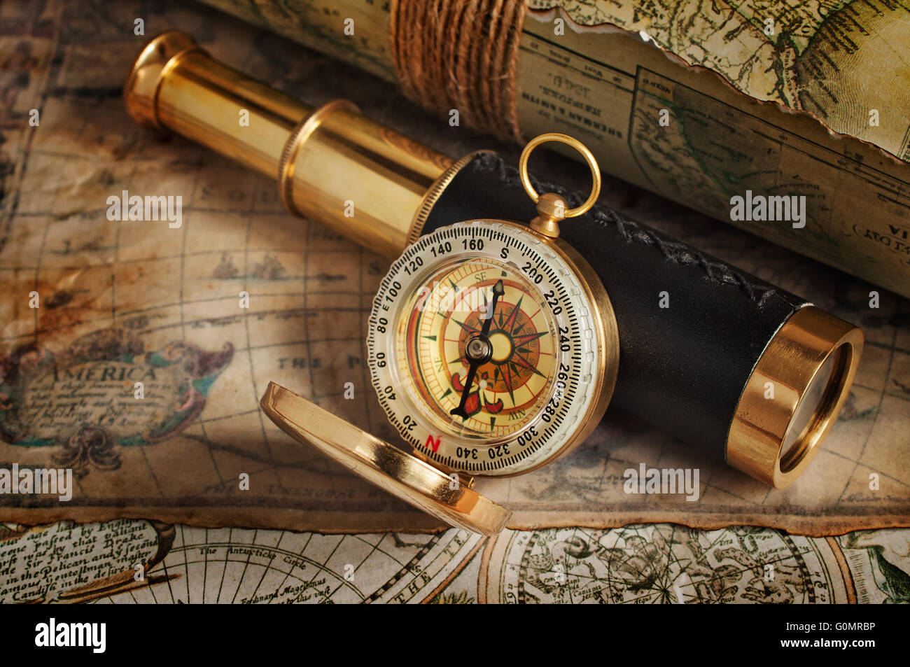 Set of vintage instruments for navigation compass, telescope and map