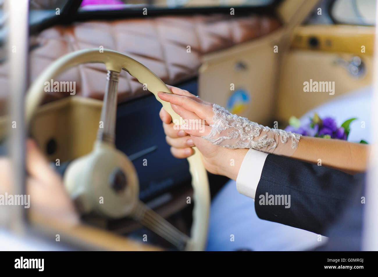 Mens hand on steering wheel hi-res stock photography and images - Alamy