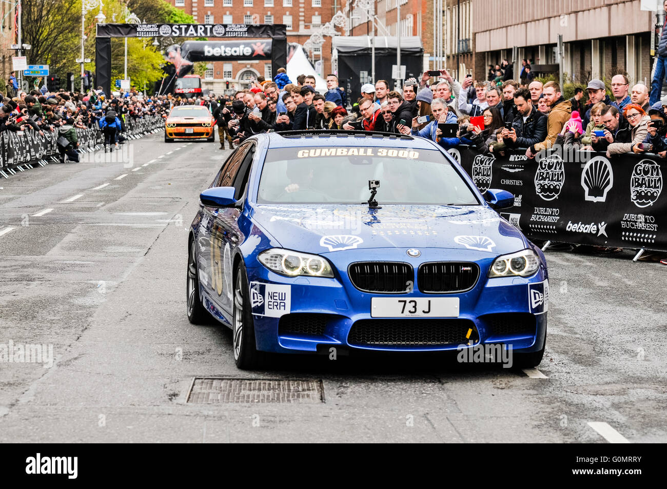 DUBLIN, IRELAND. MAY 01 2016 - A BMW M5 starts off on a 6 day drive to Bucharest from Dublin as part of the Gumball 3000 rally. Stock Photo