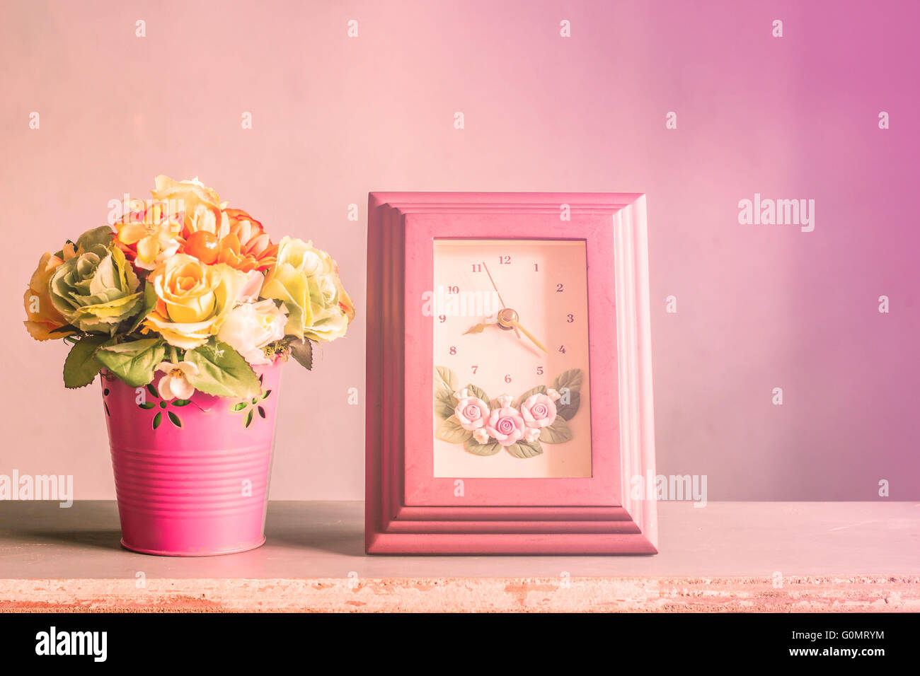 Flowers and clock on the wooden with vintage Stock Photo - Alamy