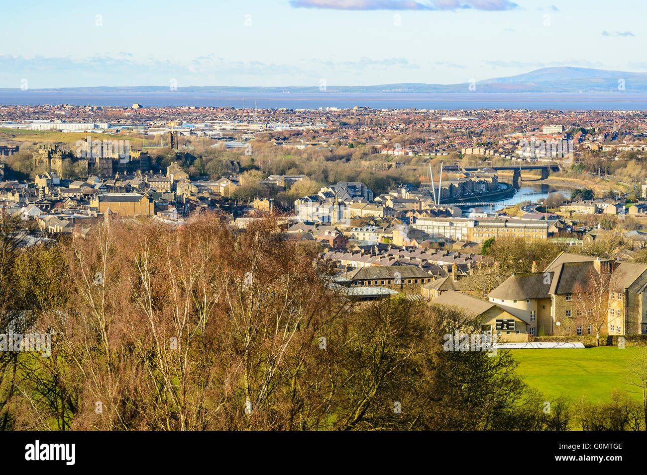 View over Lancaster England with Morecambe Bay and Black Combe beyond. Castle Hill and the River Lune stand out Stock Photo