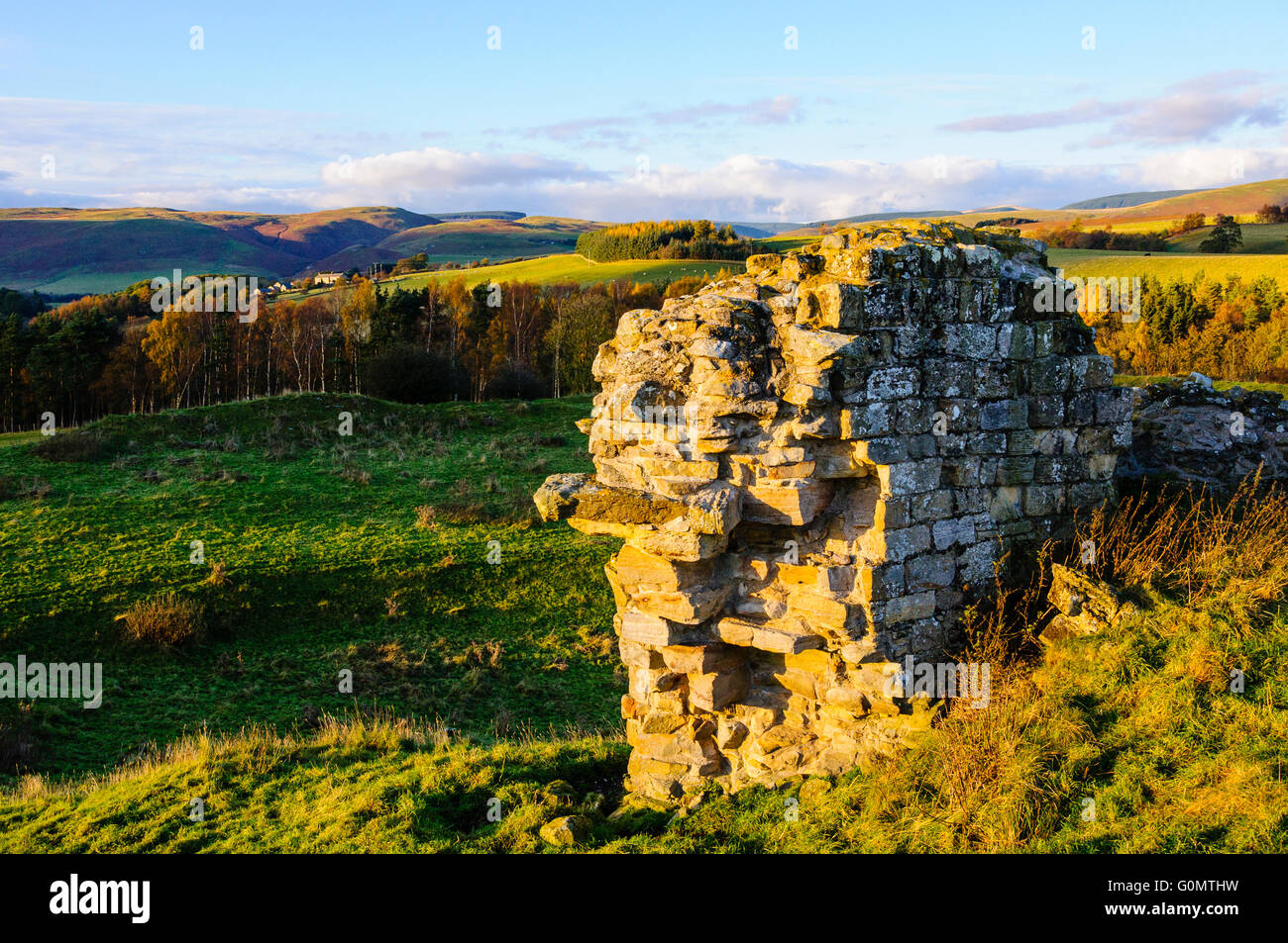 Evening light on remains of Harbottle Castle in Northumberland National Park England Stock Photo