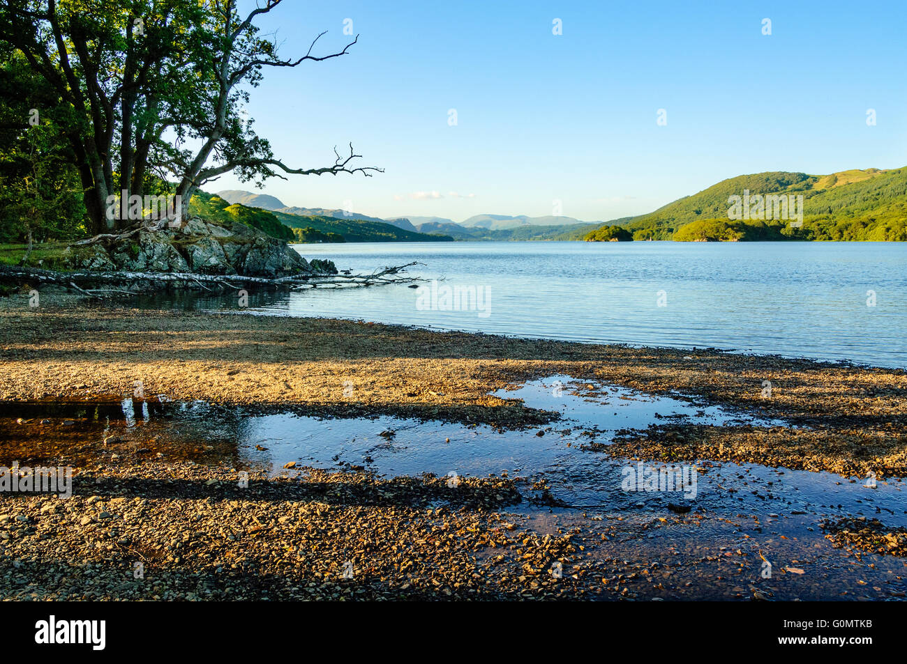 Summer evening on Coniston Water with Peel Island right of centre and Fairfield on the skyline Stock Photo