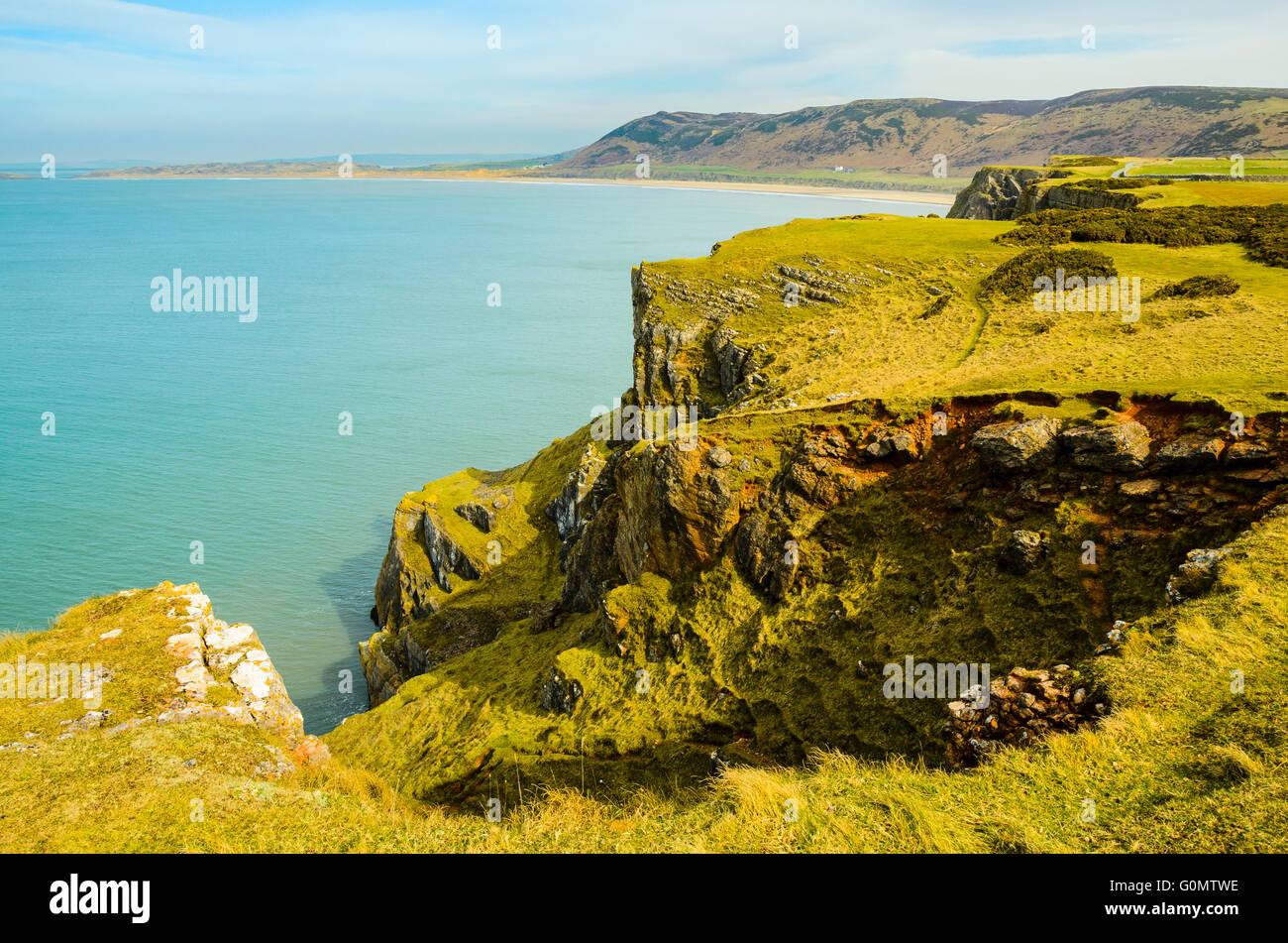 View from Worms Head towards Rhossili Bay and beach on the Gower Peninsula in South Wales Stock Photo