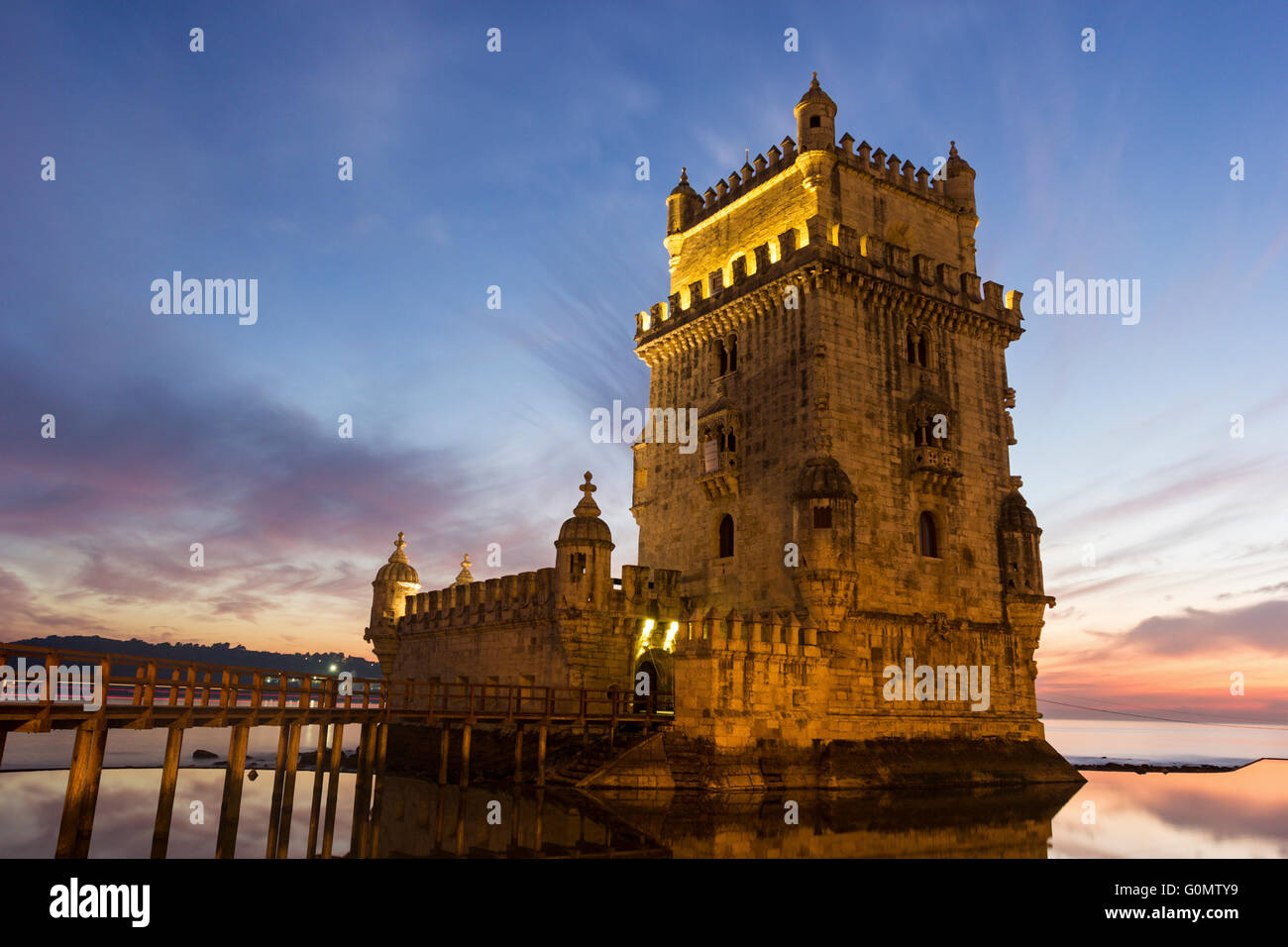 The iconic facade of the Tower of Belem on the bank of the Tagus River ...