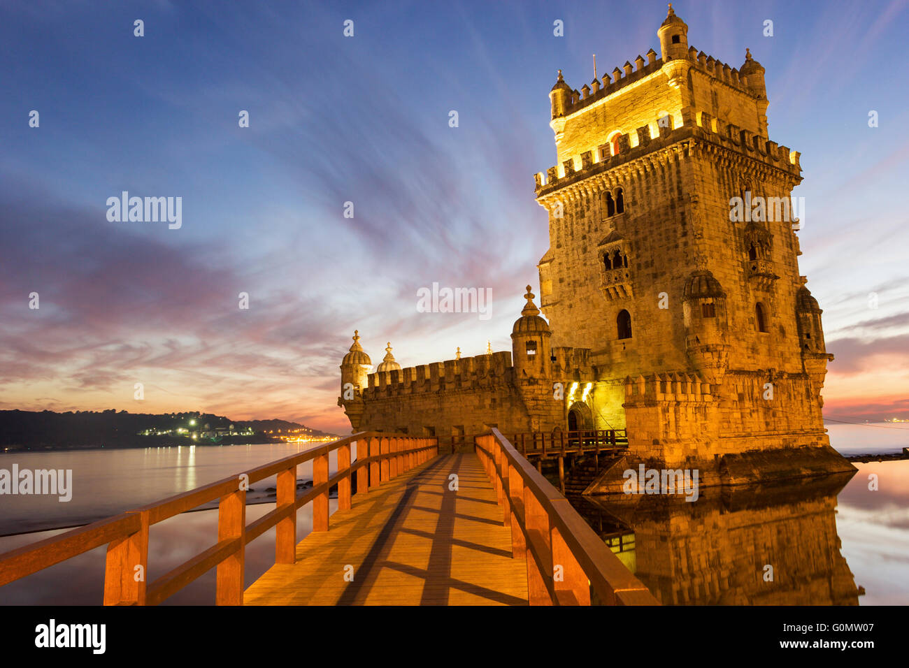 The iconic facade of the Tower of Belem on the bank of the Tagus River ...