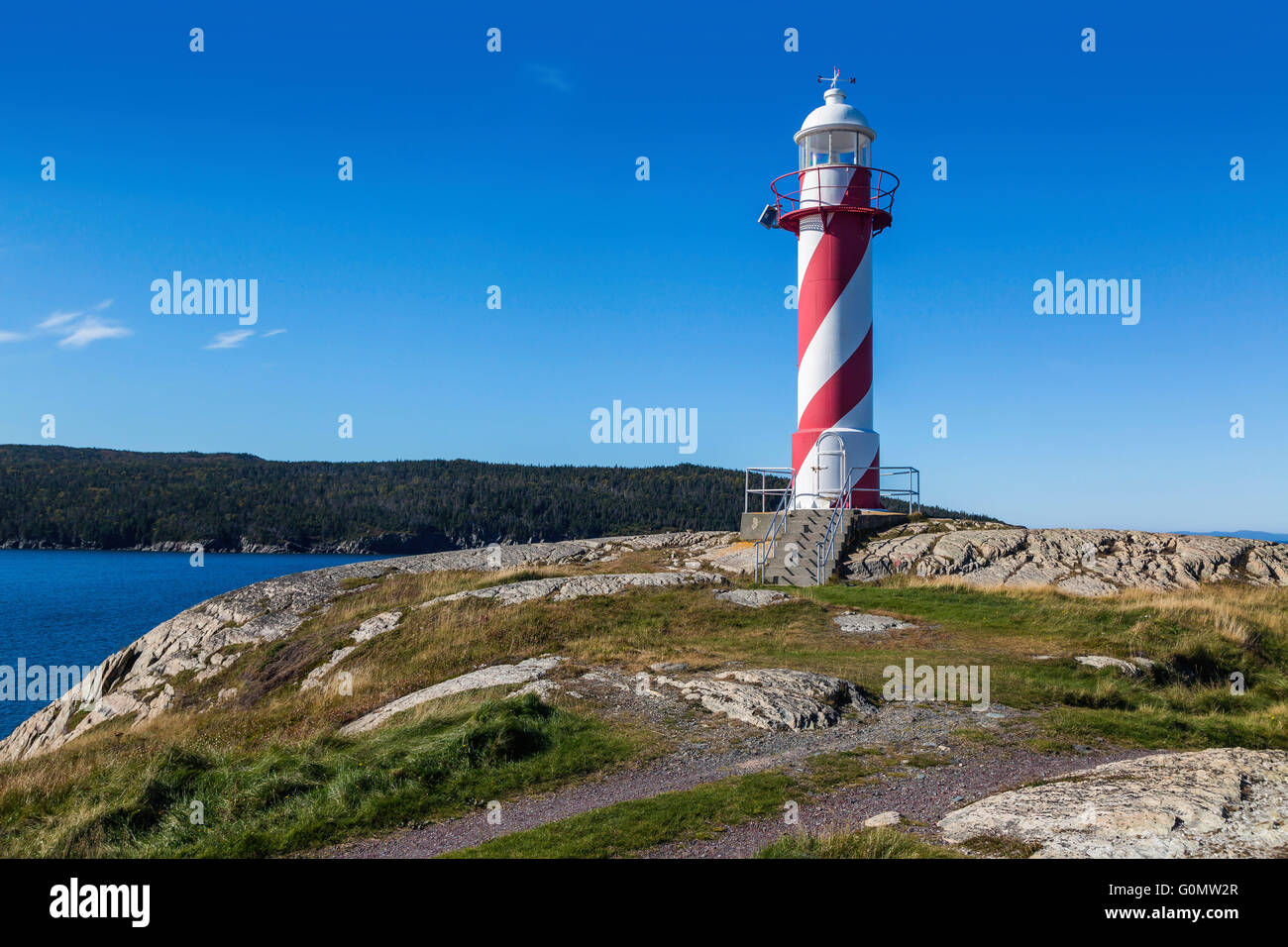 Candy cane colored lighthouse in Heart's Delight, Newfoundland, Canada. Stock Photo