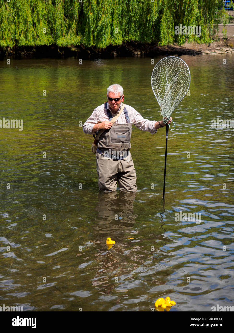 Man holding duck standing in High Resolution Stock Photography and ...