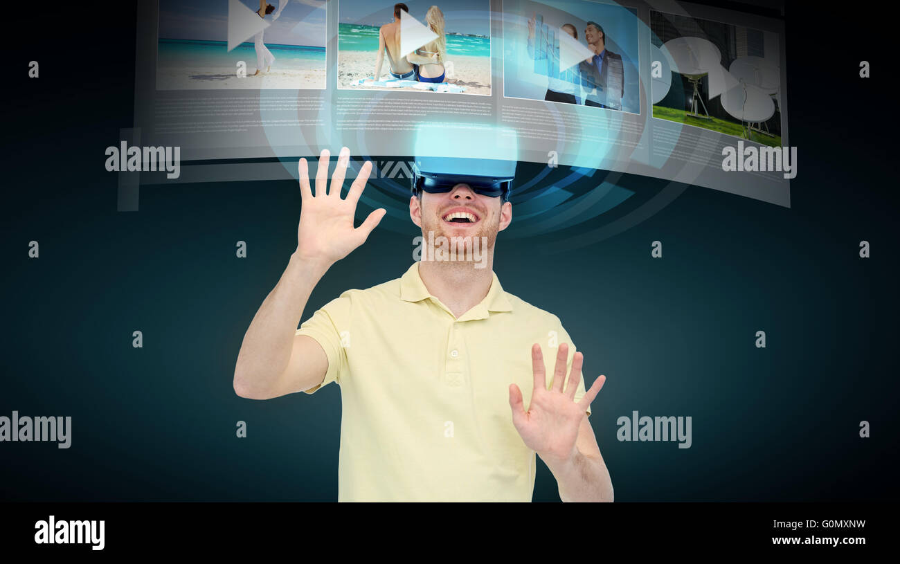 happy man in virtual reality headset or 3d glasses Stock Photo