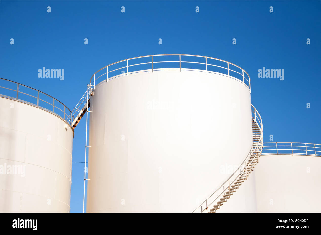Fuel storage tanks and blue sky Stock Photo