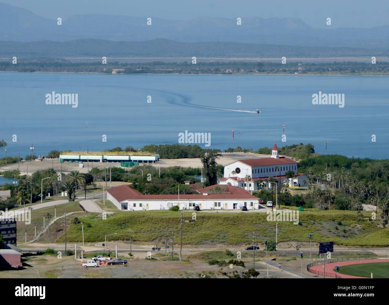 View of the chapel and Havana harbor seen from John Paul Jones Hill at Naval Station Guantanamo Bay December 15, 2015 in Guantanamo Bay, Cuba. Naval Station Guantanamo Bay was established in 1903, making it the oldest overseas naval installation in operation. Stock Photo