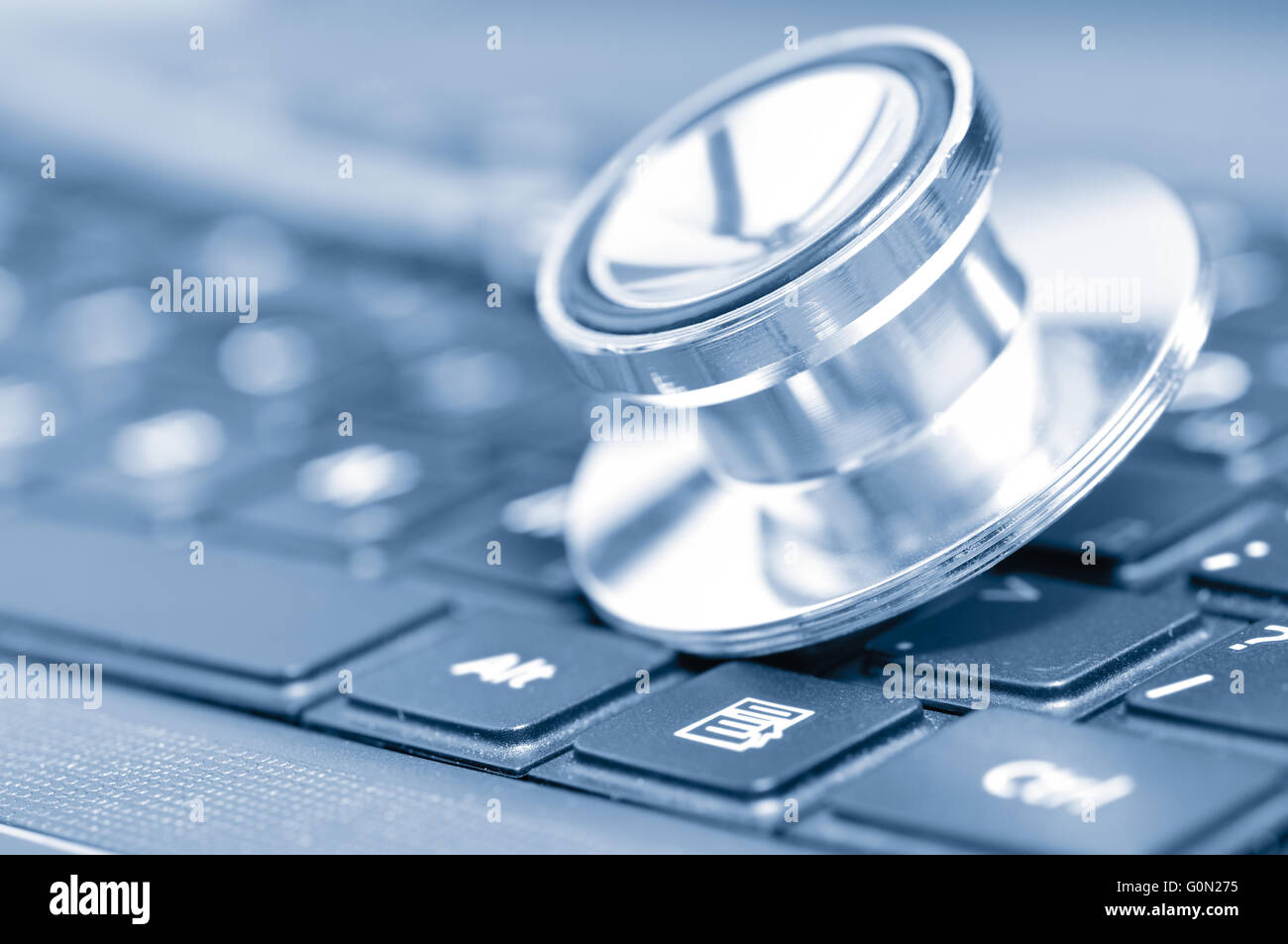 closeup if a stethoscope on a computer keyboard Stock Photo - Alamy