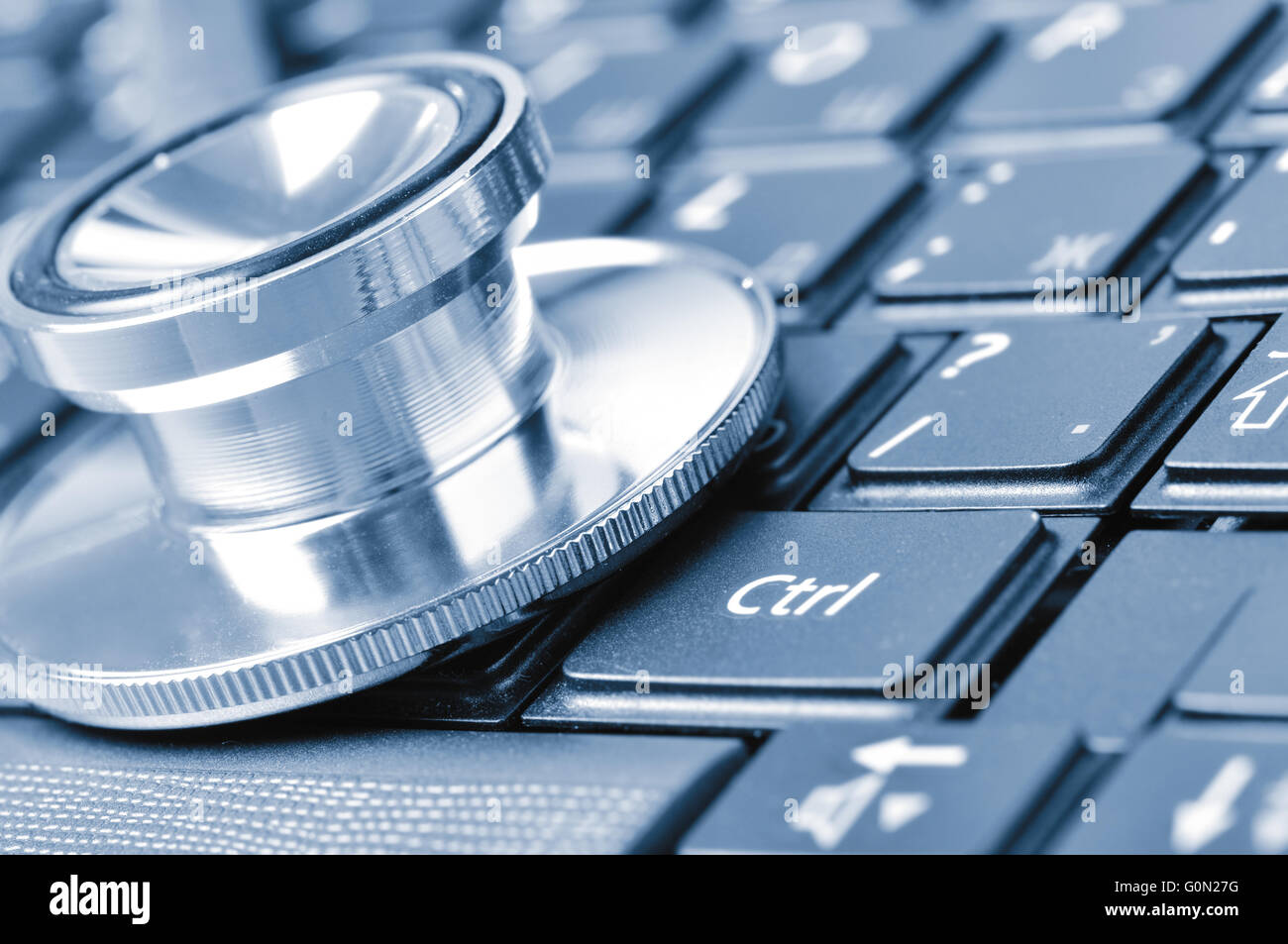 closeup if a stethoscope on a computer keyboard Stock Photo - Alamy