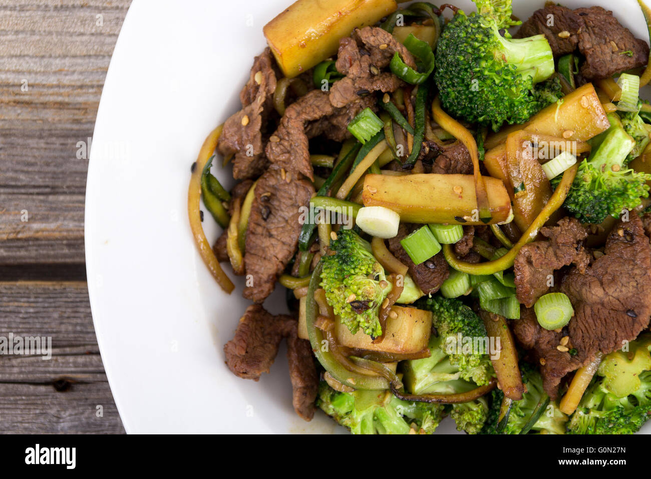 asian beef and broccoli stir fry with zucchini noodle glutenfree Stock Photo Alamy
