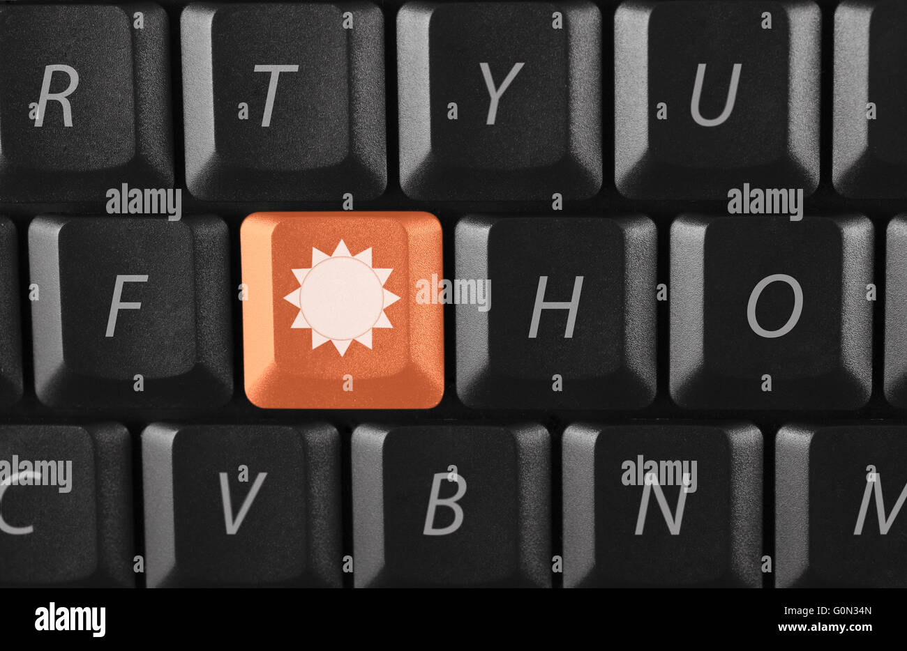 sun key on black keyboard Stock Photo Alamy