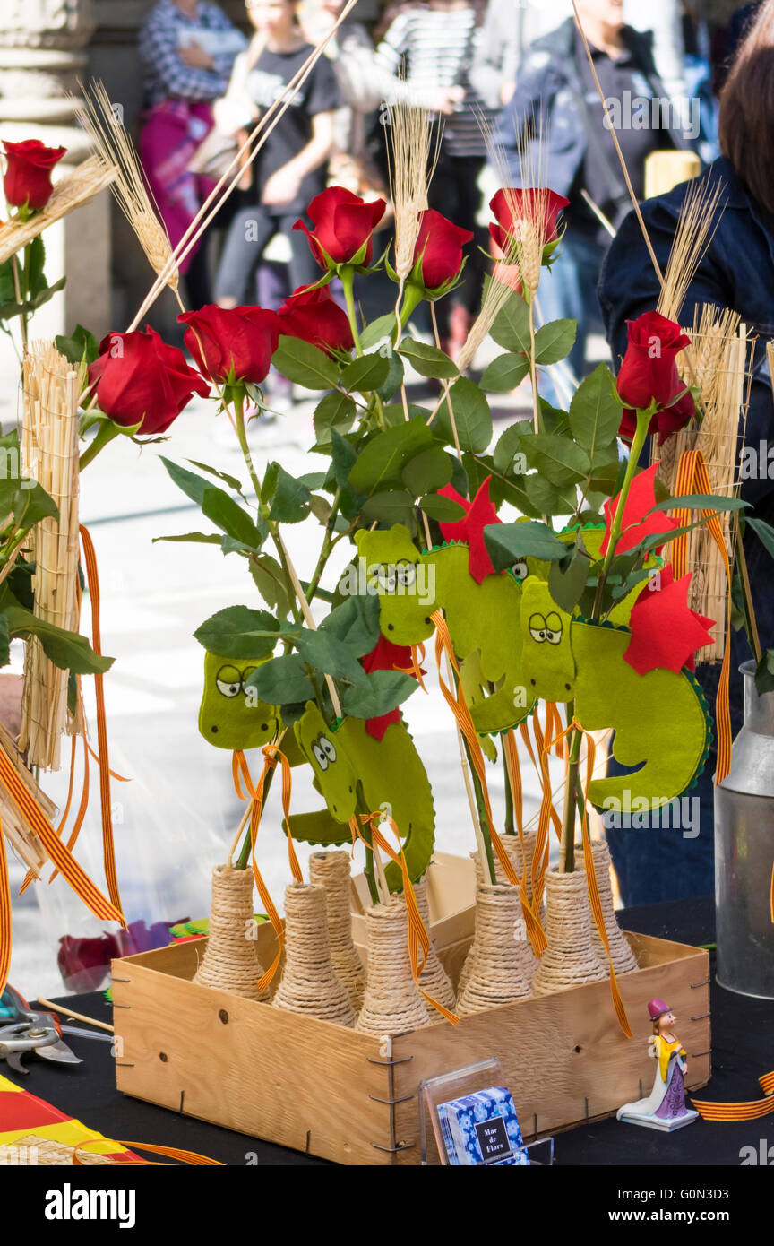 Roses decorated with dragons for sale on a booth on Diada de Sant Jordi (Saint George's day), 23 April, in Barcelona, Spain. Stock Photo