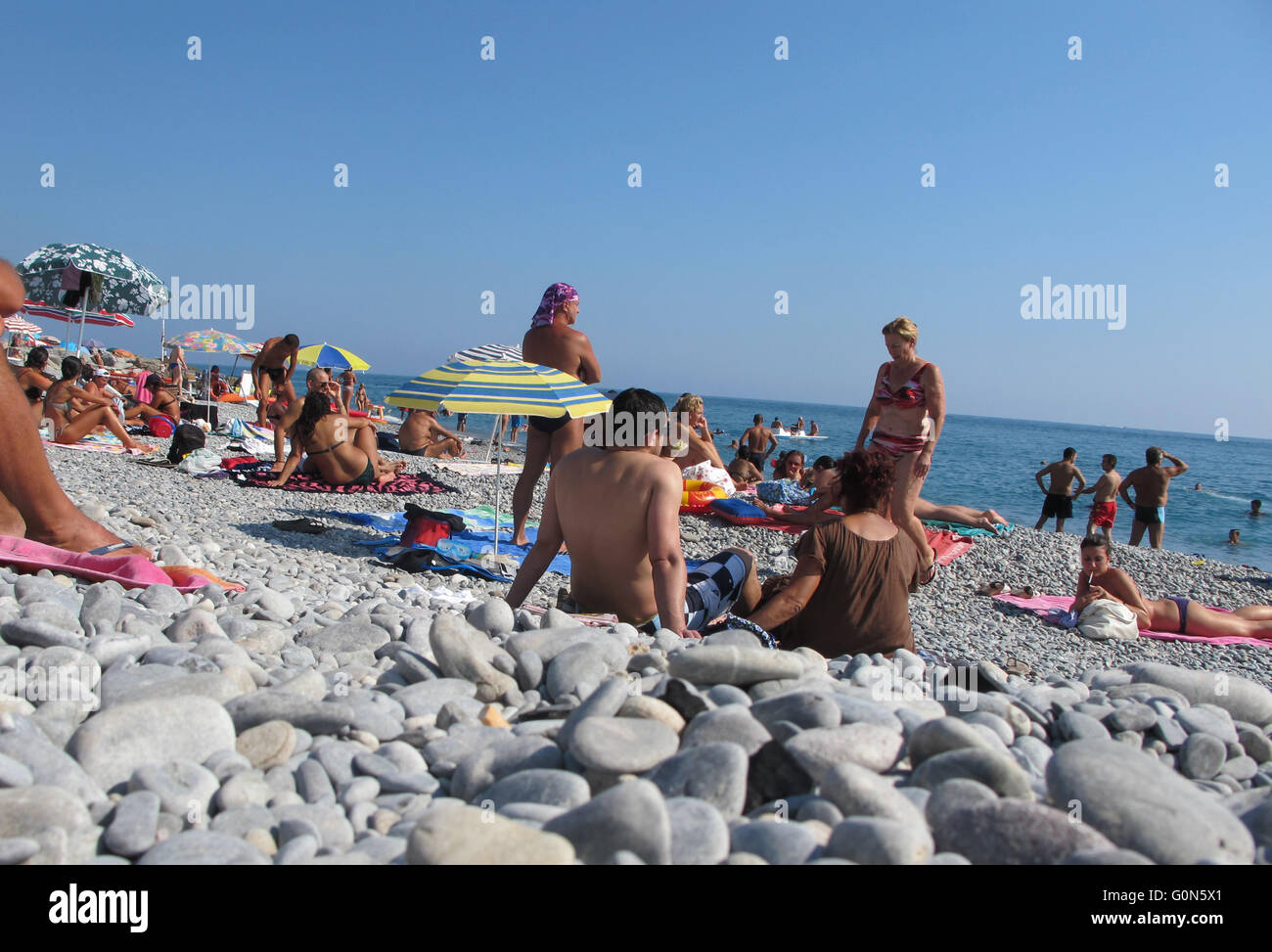 Italy, Ventimiglia,   beach with sunbathers Stock Photo