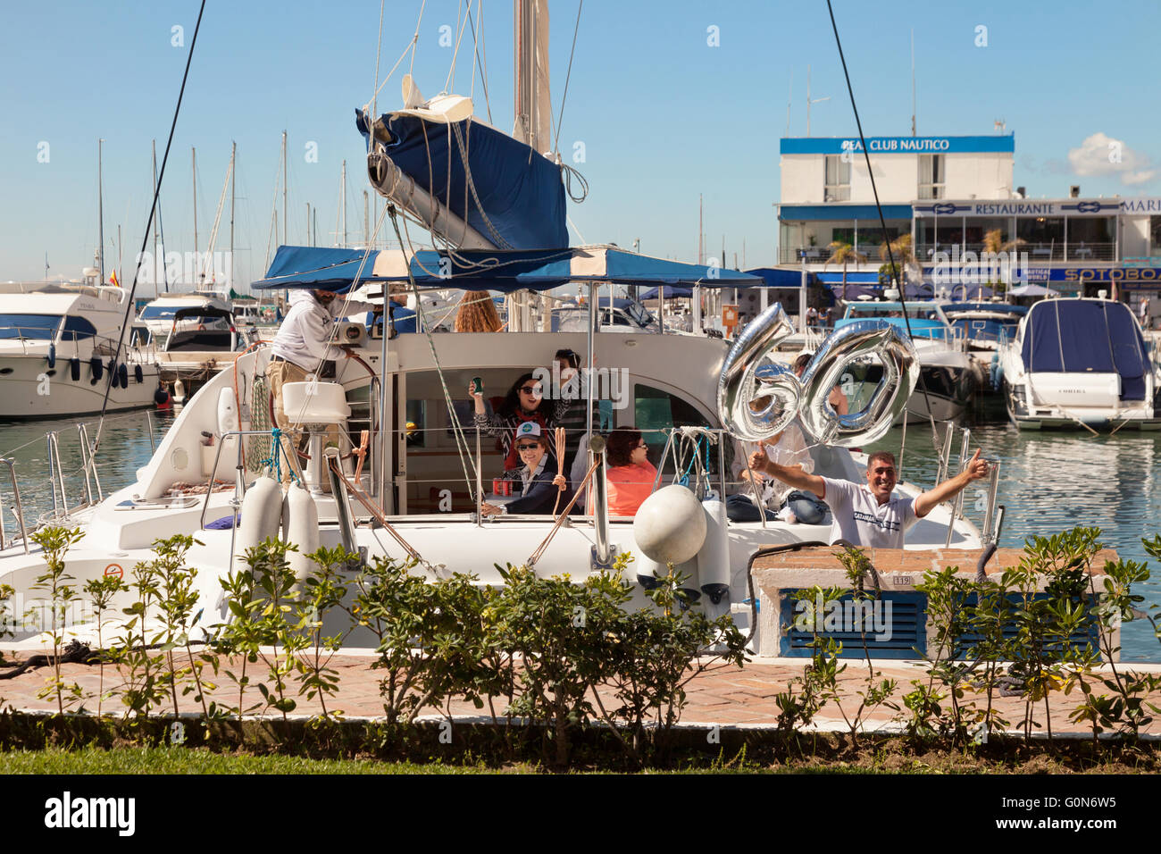 60th birthday party celebrations on board a yacht, Estepona marina, Costa del Sol, Spain Europe Stock Photo