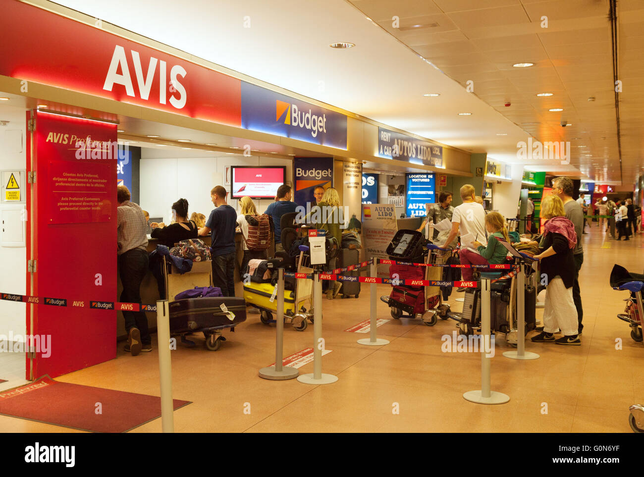 Holiday makers queue at car rental desks, Malaga airport, Costa del Sol, Spain, Europe Stock Photo