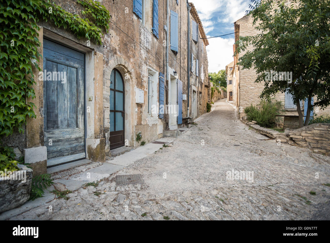 Old French village houses and cobblestone street Stock Photo